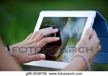 Woman during online chat with a tablet. View Large Photo Image Stock Photography - Woman during online chat with a tablet.. Fotosearch