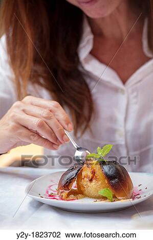 Woman eating baked apple. View Large Photo Image Stock Image - Woman eating baked apple.. Fotosearch