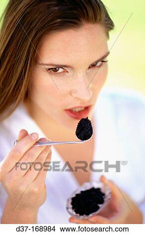 Woman eating caviar View Large Photo Image Picture - Woman eating caviar. Fotosearch