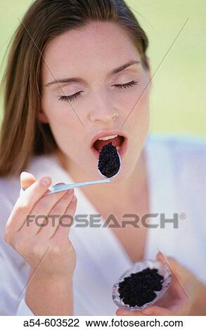 Woman eating caviar View Large Photo Image Stock Image - Woman eating caviar. Fotosearch