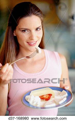Woman eating cheese View Large Photo Image Stock Image - Woman eating cheese. Fotosearch