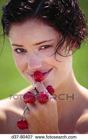 Woman eating cherries View Large Photo Image Stock Photo - Woman eating cherries. Fotosearch