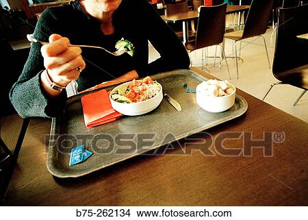 Woman eating View Large Photo Image Picture - Woman eating. Fotosearch