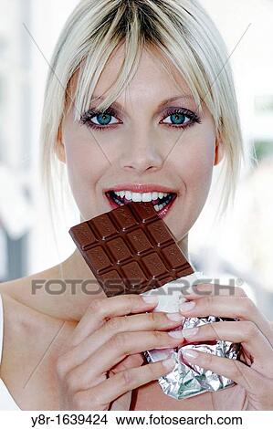Picture - woman eating. Fotosearch