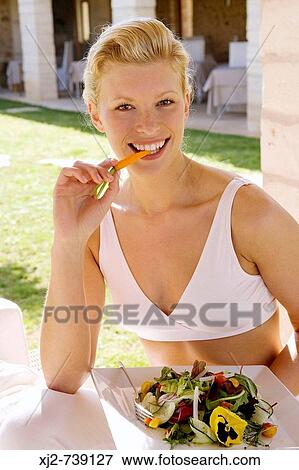 Woman eating salad View Large Photo Image Stock Photo - Woman eating salad. Fotosearch