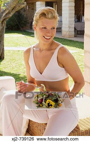 Woman eating salad View Large Photo Image Stock Photograph - Woman eating salad. Fotosearch