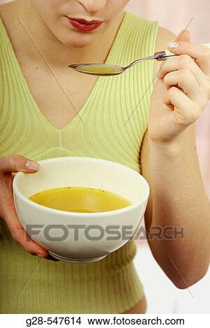 Woman eating soup. View Large Photo Image Picture - Woman eating soup.. Fotosearch