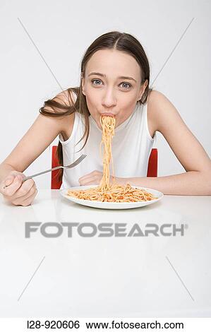 Woman Eating Spaghetti View Large Photo Image Stock Photograph - Woman Eating Spaghetti. Fotosearch