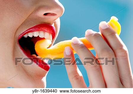 Stock Image - woman eating. Fotosearch