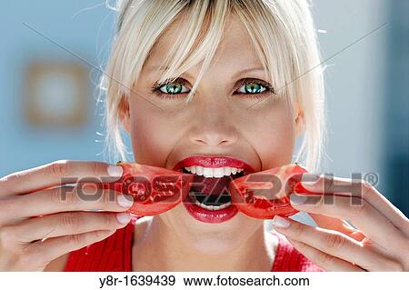 Stock Photo - woman eating. Fotosearch