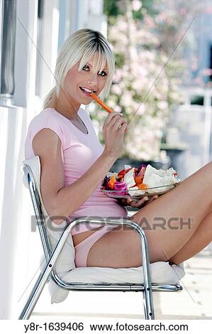 Stock Photograph - woman eating. Fotosearch