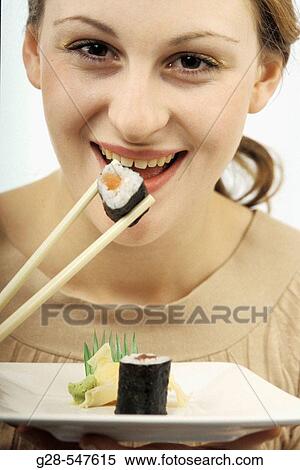Woman eating sushi. View Large Photo Image Stock Photography - Woman eating sushi.. Fotosearch