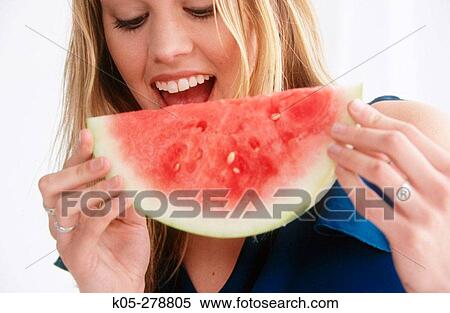 Stock Photography - Woman Eating Watermelon. Fotosearch