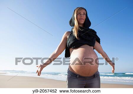 Woman Enjoying Her Pregnancy. View Large Photo Image Stock Image - Woman Enjoying Her Pregnancy.. Fotosearch