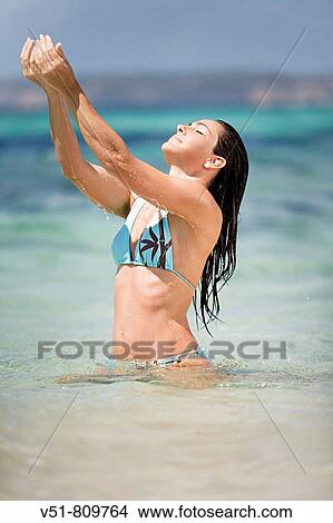 Woman enjoying in the sea View Large Photo Image Picture - Woman enjoying in the sea. Fotosearch