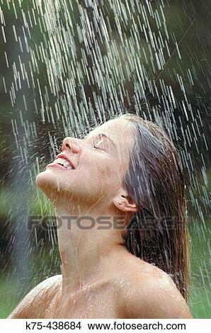 Woman enjoying outdoor shower View Large Photo Image Picture - Woman enjoying outdoor shower. Fotosearch