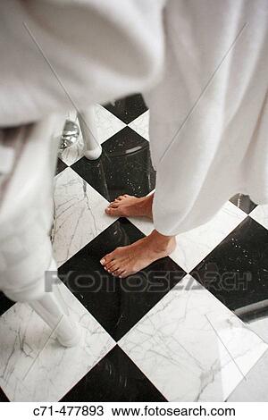 Woman feet on black and white tiled bathroom floor View Large Photo Image Stock Image - Woman feet on black and white tiled bathroom floor. Fotosearch