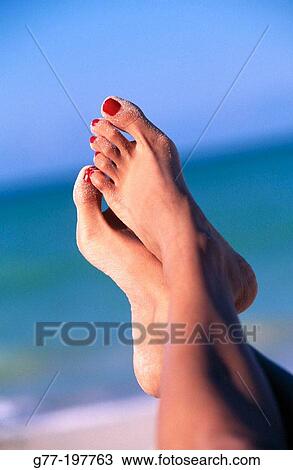 Woman feet on the beach View Large Photo Image Stock Image - Woman feet on the beach. Fotosearch