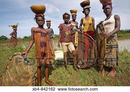 Woman fishing, Doune, Republic of Guinea View Large Photo Image Stock Image - Woman fishing, Doune, Republic of Guinea. Fotosearch