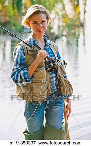 Stock Photo - woman fly fisherman. Fotosearch