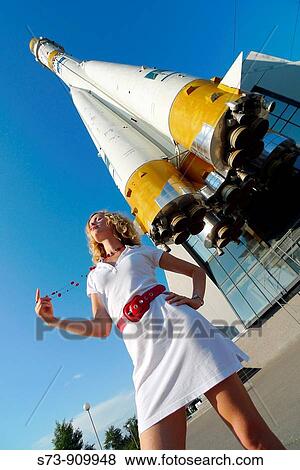 Woman front the Russian space transport rocket. A museum piece. Samara. Russia. View Large Photo Image Stock Photo - Woman front the Russian space transport rocket. A museum piece. Samara. Russia.. Fotosearch