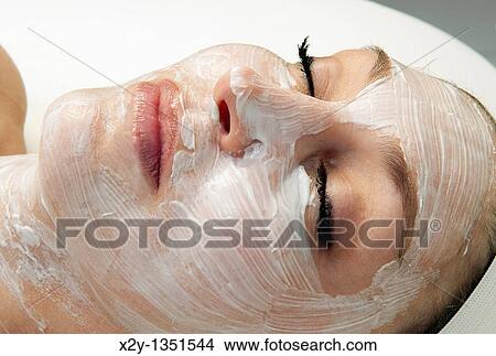 Woman getting a facial treatment at a spa View Large Photo Image Picture - Woman getting a facial treatment at a spa. Fotosearch