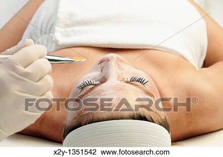 Woman getting a facial treatment at a spa View Large Photo Image Stock Image - Woman getting a facial treatment at a spa. Fotosearch