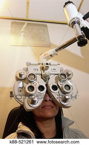 Woman getting an eye exam View Large Photo Image Stock Image - Woman getting an eye exam. Fotosearch