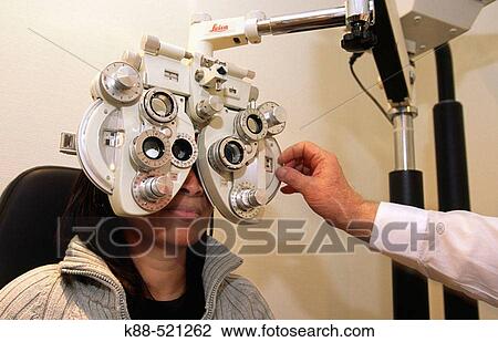 Woman getting an eye exam View Large Photo Image Stock Image - Woman getting an eye exam. Fotosearch