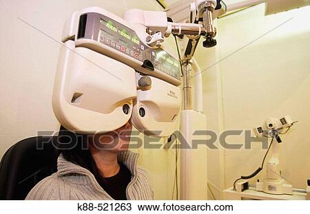 Stock Image - Woman getting an eye exam. Fotosearch
