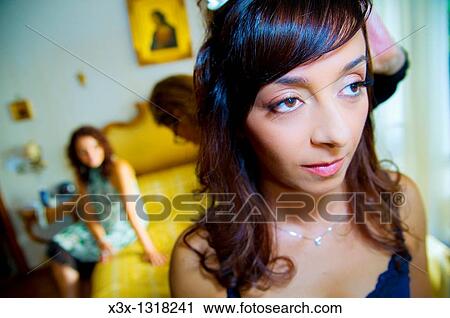 Woman getting her hair curled before wedding View Large Photo Image Stock Image - Woman getting her hair curled before wedding. Fotosearch