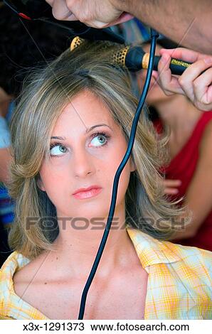 Woman getting her hair done at hair salon View Large Photo Image Stock Image - Woman getting her hair done at hair salon. Fotosearch