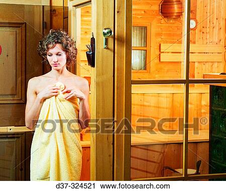 Woman getting out of sauna View Large Photo Image Stock Image - Woman getting out of sauna. Fotosearch