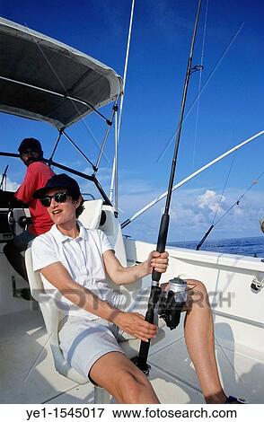 Woman going fishing on a boat in the Pacific Ocean, off Vanuatu View Large Photo Image Stock Photo - Woman going fishing on a boat in the Pacific Ocean, off Vanuatu. Fotosearch