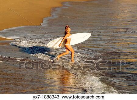 Woman going in the sea with a surf board. Las Breas, Costa de la Luz, Cadiz, Andalusia, Spain, Europe. View Large Photo Image Stock Image - Woman going in the sea with a surf board. Las Breas, Costa de la Luz, Cadiz, Andalusia, Spain, Europe.. Fotosearch