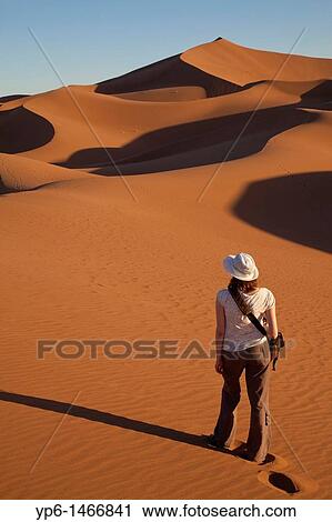 woman going on sand-dunes, Erg Chegaga, Sahara, Morocco View Large Photo Image Stock Image - woman going on sand-dunes, Erg Chegaga, Sahara, Morocco. Fotosearch