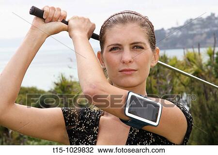 woman golfing with an iphone View Large Photo Image Stock Image - woman golfing with an iphone. Fotosearch