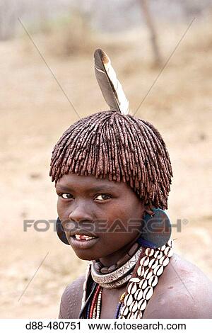 Woman Hamer tribe. Lower basin of Omo river. Copper skin with very fine features and wear metal arm and leg bracelets, shells and beads. South Ethiopia. View Large Photo Image Stock Image - Woman Hamer tribe. Lower basin of Omo river. Copper skin with very fine features and wear metal arm and leg bracelets, shells and beads. South Ethiopia.. Fotosearch