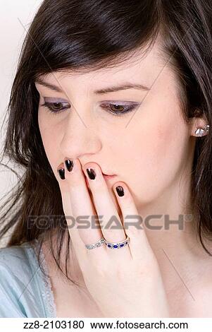 Woman hand covering mouth looking away. View Large Photo Image Stock Image - Woman hand covering mouth looking away.. Fotosearch