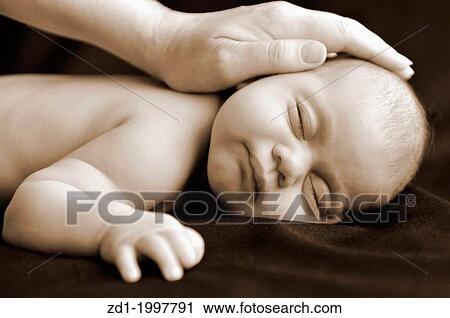 Woman hand on newborn baby sleep in peace. View Large Photo Image Stock Image - Woman hand on newborn baby sleep in peace.. Fotosearch
