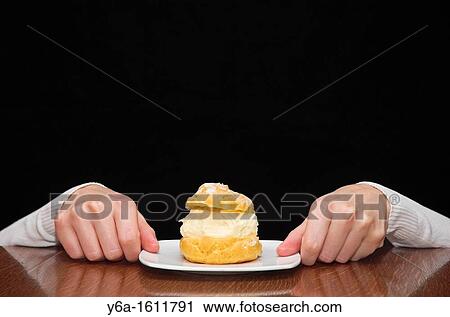 Woman hands reaching for a cake on table View Large Photo Image Stock Image - Woman hands reaching for a cake on table. Fotosearch