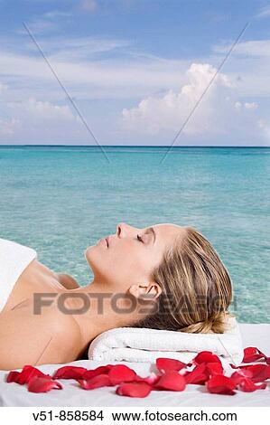 Woman having a massage by the sea View Large Photo Image Picture - Woman having a massage by the sea. Fotosearch