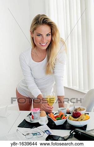 Picture - Woman having breakfast. Fotosearch