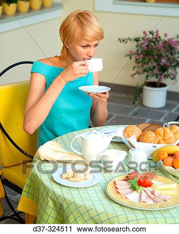 Woman having breakfast View Large Photo Image Stock Image - Woman having breakfast. Fotosearch