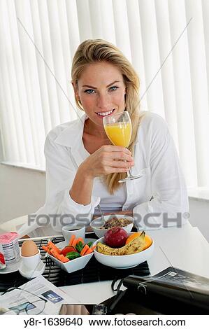 Woman having breakfast View Large Photo Image Stock Image - Woman having breakfast. Fotosearch