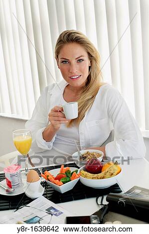 Woman having breakfast View Large Photo Image Stock Image - Woman having breakfast. Fotosearch