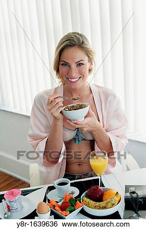 Woman having breakfast View Large Photo Image Stock Photograph - Woman having breakfast. Fotosearch