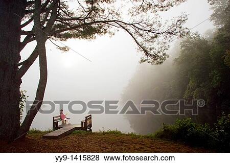 Woman having morning coffee on dock - Brevard, North Carolina View Large Photo Image Stock Photo - Woman having morning coffee on dock - Brevard, North Carolina. Fotosearch