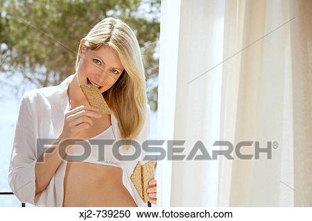 Woman healthy eating crackers View Large Photo Image Stock Image - Woman healthy eating crackers. Fotosearch