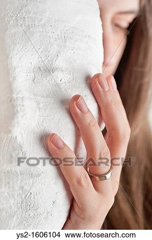 Woman hiding behind a mask View Large Photo Image Picture - Woman hiding behind a mask. Fotosearch